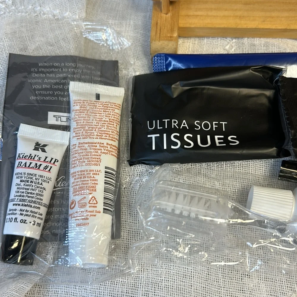 Tumi NWT cosmetic travel bag filled with goodies all new in packages